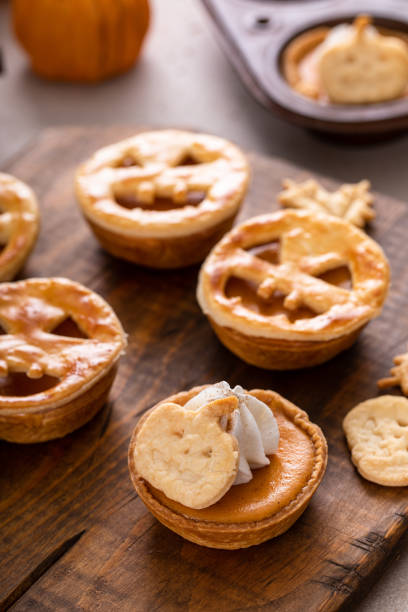 istock Mini pumpkin pies for Halloween topped with Jack o Lanterns 1968539678