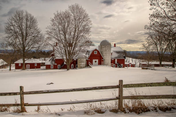 istock Beautiful red barn on a snowy winter afternoon 1968547014