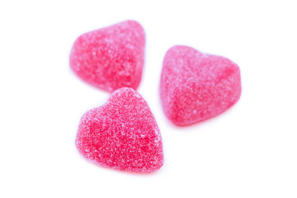istock Isolated group of bright pink marmalade sugared delights. 1968556827