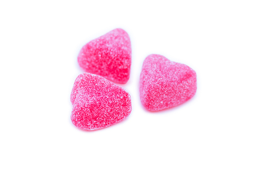 Group of vibrant pink jelly sugared candies as a treat for St. Valentine's day, isolated.