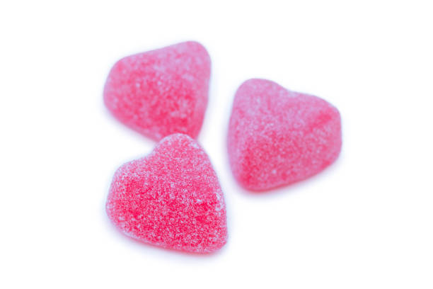 istock Isolated group of bright pink marmalade sugared delights. 1968556834