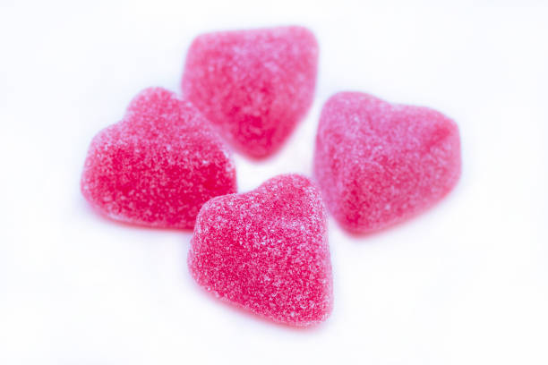 istock Isolated group of bright pink marmalade sugared delights. 1968556835