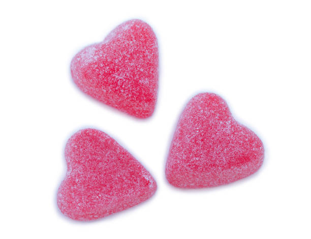 istock Isolated group of bright pink marmalade sugared delights. 1968557316