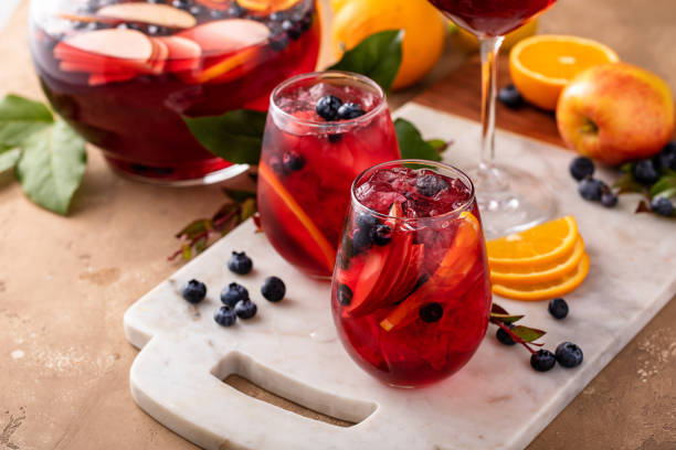 istock Winter orange and berry sangria with sliced oranges and blueberries 1968568461