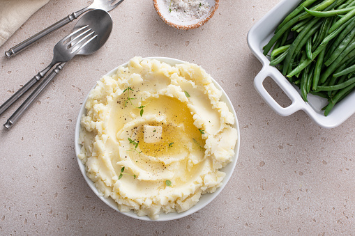 Mashed potatoes in a serving bowl, traditional side dish for every day dinner or celebration