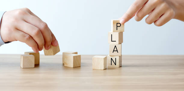 istock Hands holding wood blocks with plan word, business concept 1968696532