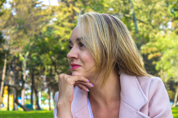 Beautiful young woman posing in the nature