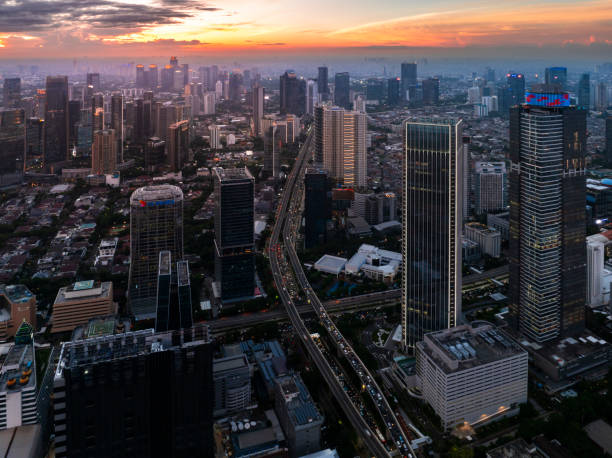 istock the panoramic view of jakarta city with beautiful sunset using drone 1968758023