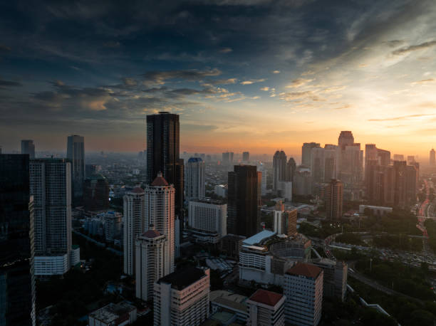 istock the panoramic view of jakarta city with beautiful sunset using drone 1968759662