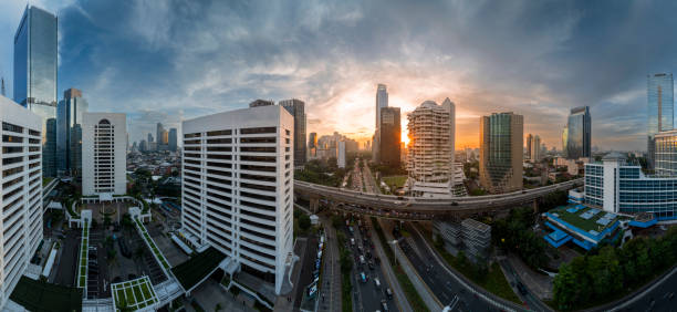 istock the panoramic view of jakarta city with beautiful sunset using drone 1968760224