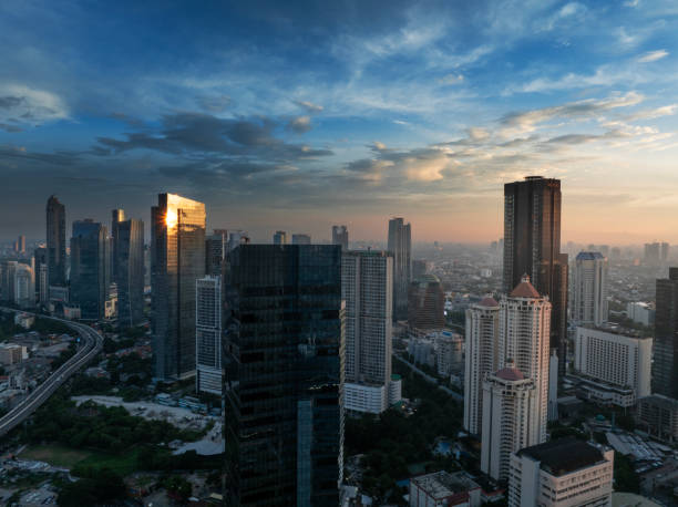 istock the panoramic view of jakarta city with beautiful sunset using drone 1968760225