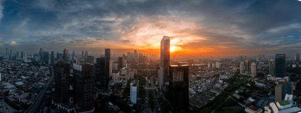 istock the panoramic view of jakarta city with beautiful sunset using drone 1968760751