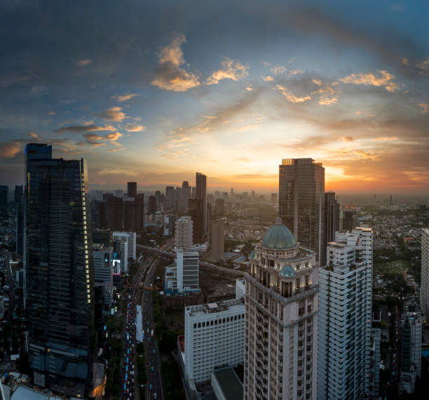 istock the panoramic view of jakarta city with beautiful sunset using drone 1968763531