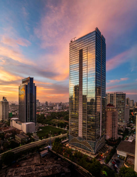 istock the panoramic view of jakarta city with beautiful sunset using drone 1968763952