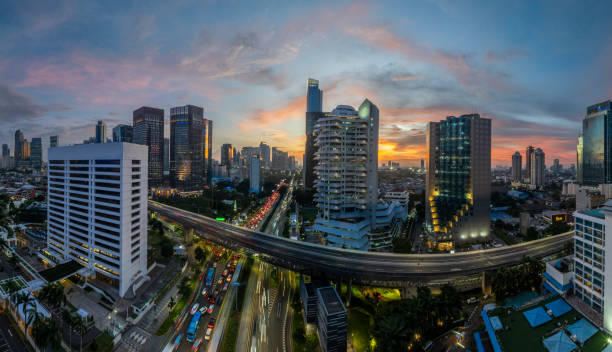 istock the panoramic view of jakarta city with beautiful sunset using drone 1968764066