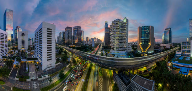 istock the panoramic view of jakarta city with beautiful sunset using drone 1968764086
