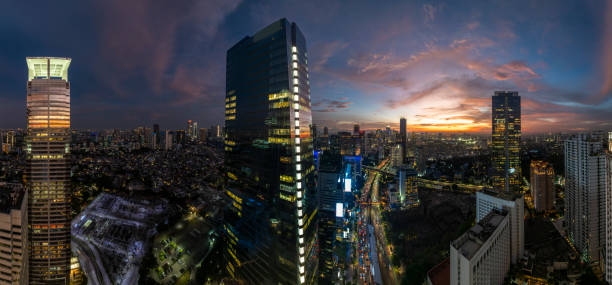 istock the panoramic view of jakarta city with beautiful sunset using drone 1968765704