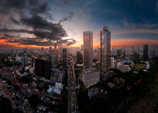 istock the panoramic view of jakarta city with beautiful sunset using drone 1968768430
