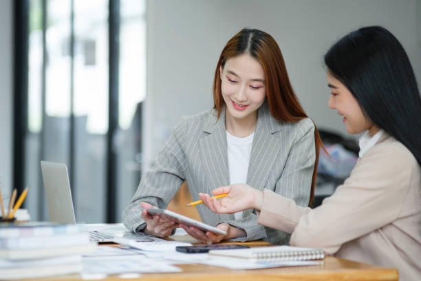 istock Manager teaching new employees with a smile 1968776379