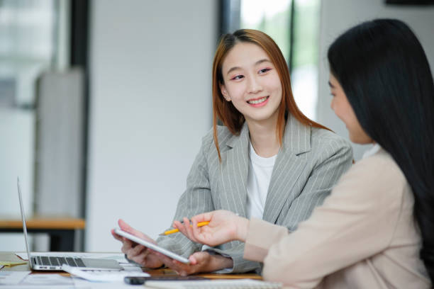 istock Manager teaching new employees with a smile 1968776391