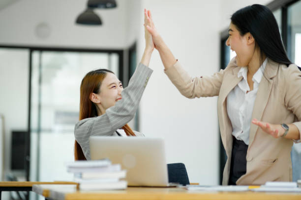 istock Successful Businesswomen Celebrating with a High Five. 1968776987