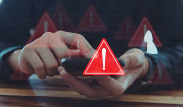 istock Emergency warning alert alarm on Smartphone, Data network protection, Virus alarm with people using application on smartphone. 1968805865