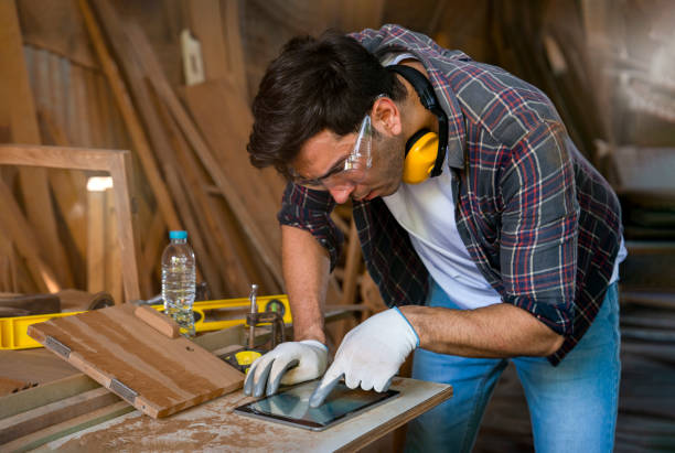 istock A young modern caucasian craftsman using tablet computer design woodcraft at the carpentry workshop 1968807173