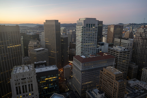 Aerial view of illuminated skyscrapers at twilight