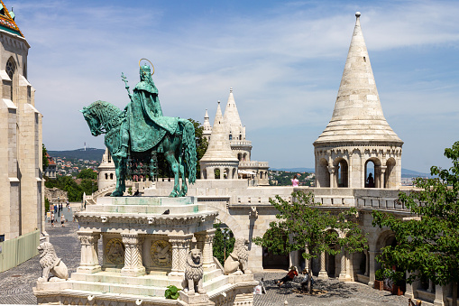 Budapest, Hungary. June, 19 - 2013: St Stephen I horseriding bronze statue and the Fishermen´s Bastion in Budapest, Hungary