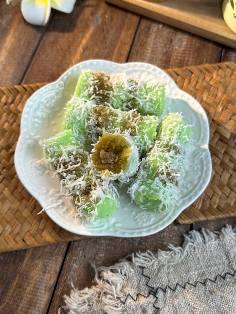 istock Steamed palm sugar rice cake in bamboo or Putu Bamboo being prepared during Ramadan buka puasa bazaar or iftar 1968878845