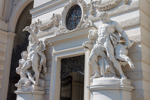 Vienna, Austria. June, 20 - 2013: Detail of the facade of the Hofburg palace in Vienna with its mythological scculptures, Austria.\nLabours of Hercules