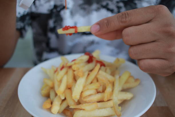 brown man enjoy fries