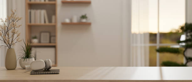 istock A wooden table with decor and copy space to display your product in a modern minimalist white room. 1968927549