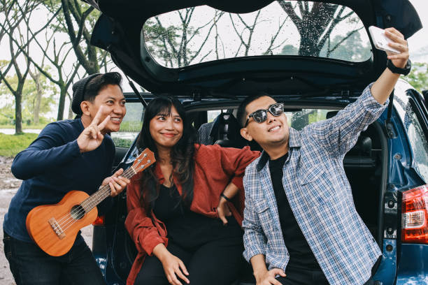 istock Happy Diverse People Around Car 1968936965