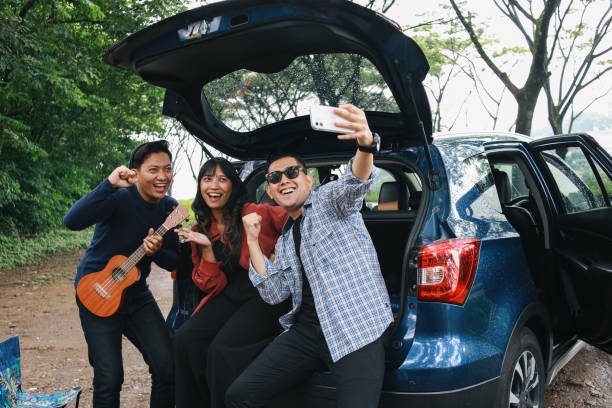 istock Happy Diverse People Around Car 1968941242