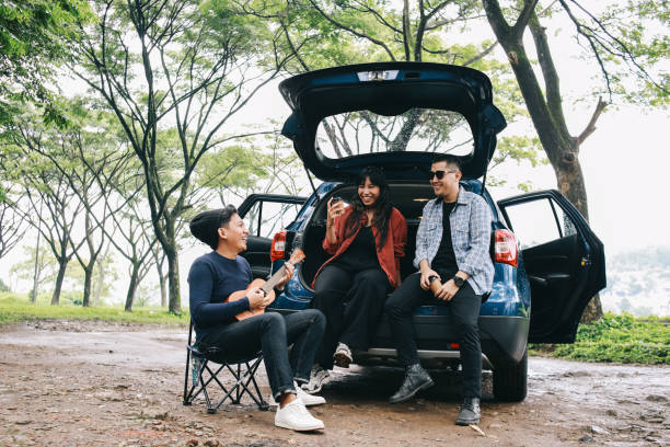 istock Happy Diverse People Around Car 1968942275