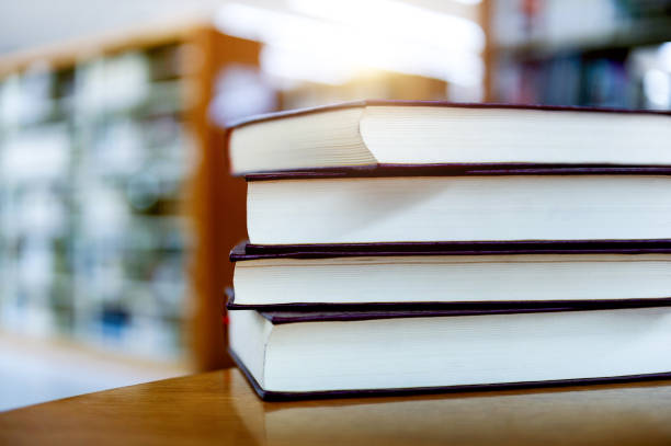 istock Library with four books stacked on desk 1968962859