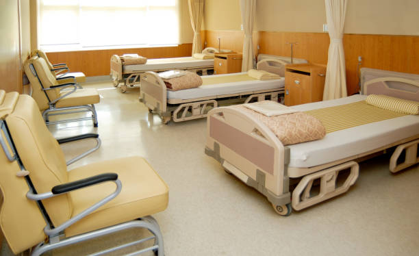 istock Clean empty beds in hospital ward 1968967136