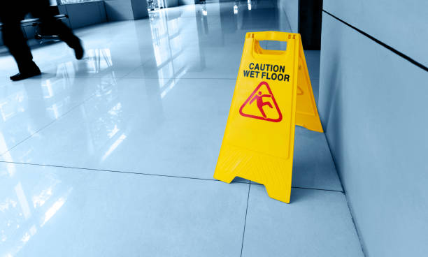 istock Cleaning and caution wet flooring signboard on the floor 1968967664