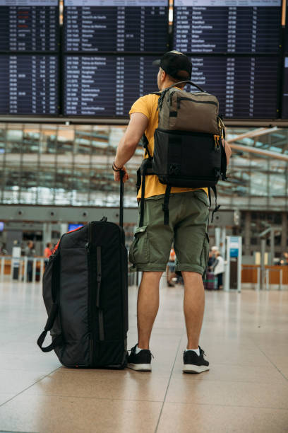istock Young man at the airport 1969060468