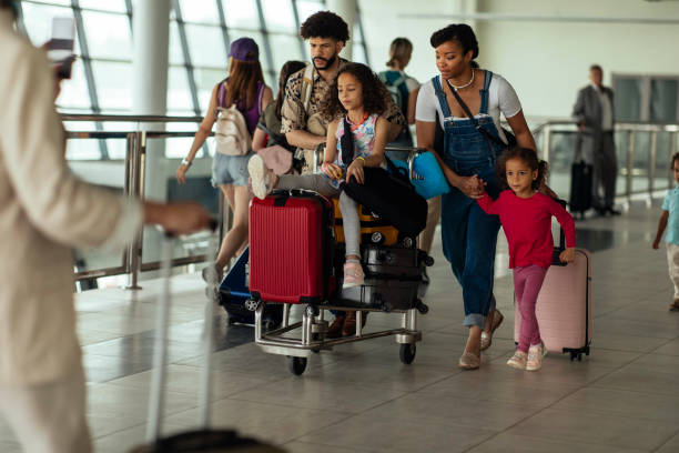 istock Family walking through the airport 1969061018