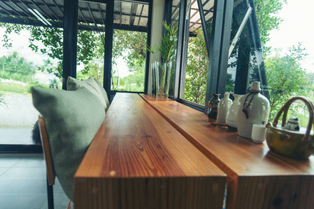 istock Blurry background interior design bar table chair window decorate indoors space display. Blurred background cafe coffee shop restaurant in shopping mall with light bokeh business event retail store 1969063635