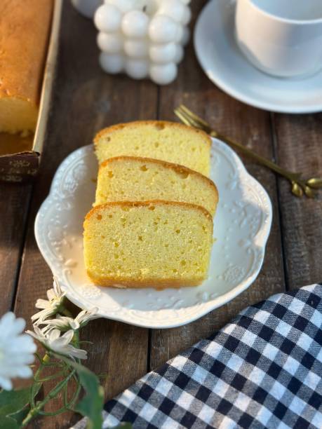 istock Slices of butter cakes with small white tea set. 1969080265
