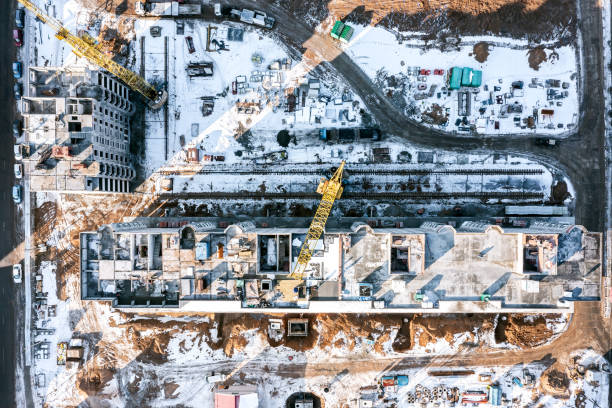 istock winter construction site with building, cranes, equipment and materials. aerial top view. 1969082591