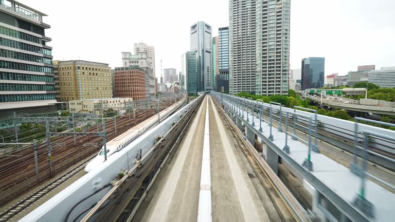 Passing Tokyo Rainbow Bridge tunnel, Yurikamome monorail train on way to Odaiba island in Tokyo Bay.