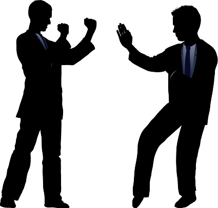 Business people fighting silhouette.