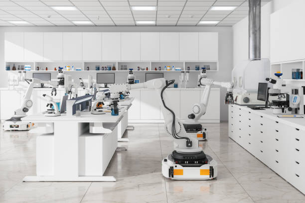 Robots Working In Science Laboratory. Modern Empty Laboratory With Computers, Microscopes, Test Tubes And Other Laboratory Equipments Robots Working In Science Laboratory. Modern Empty Laboratory With Computers, Microscopes, Test Tubes And Other Laboratory Equipments medical device engineering stock pictures, royalty-free photos & images