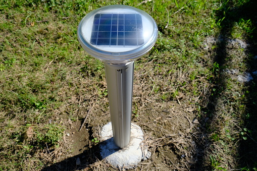 This is a solar powered pathway light on the sidewalk in Beaver Park, a place in Lafayette Louisiana.