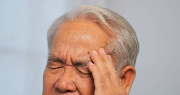 istock Asian old man with migraine headache. Elderly man suffering from a headache. 1969207524