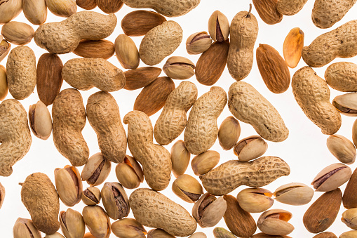 Various dry fruits and nuts. Isolated on a white background